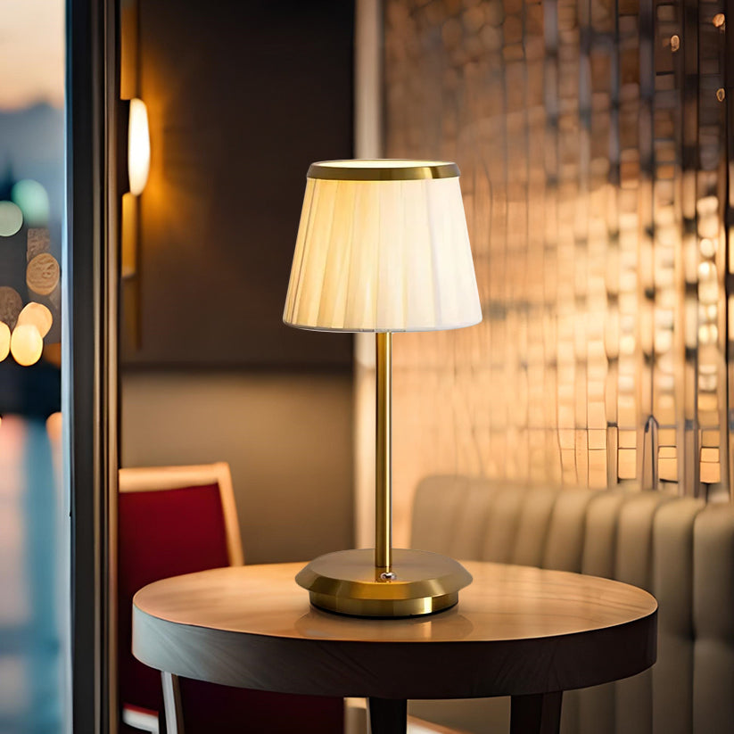 Classic Elegance dimmable LED table lamp. Soft fabric shade, stylish brass base, touch control. Modern portable lighting.