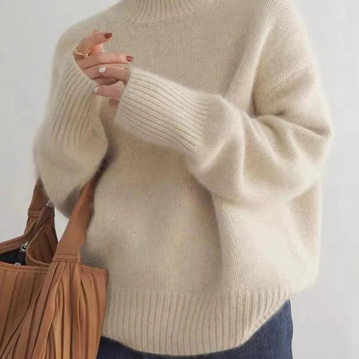 Relaxed fit women's oversized turtleneck sweater, cozy knit, essential for comfortable winter style.