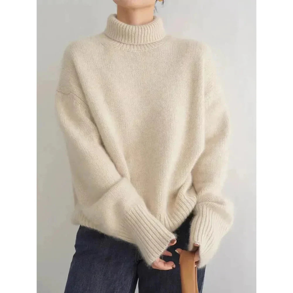 Soft, cozy knit wool turtleneck sweater for women, ideal for warm winter comfort.