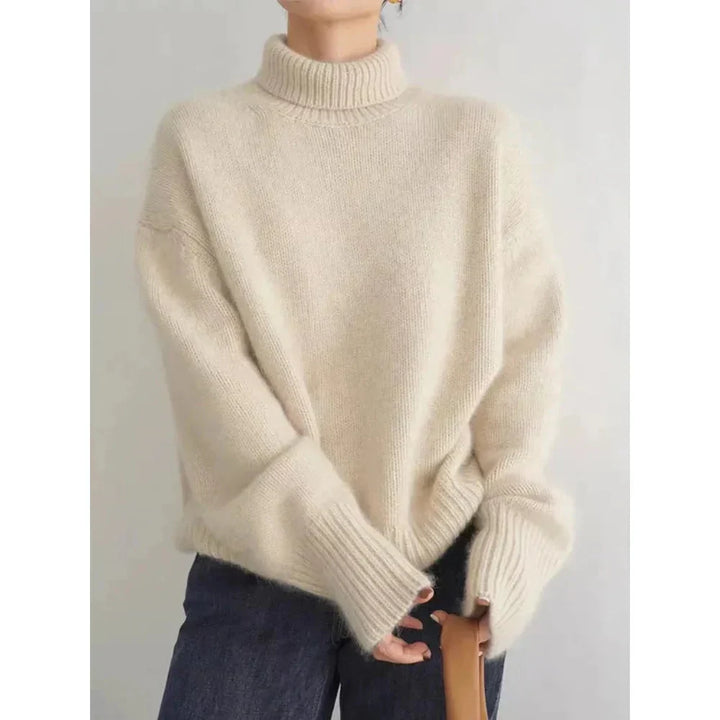 Soft, cozy knit wool turtleneck sweater for women, ideal for warm winter comfort.
