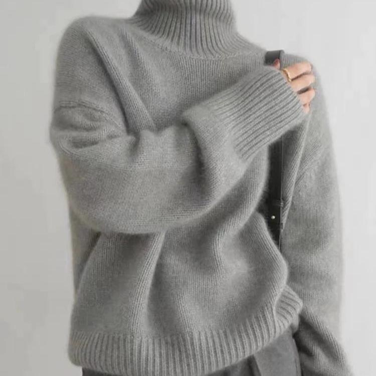 Women's cozy knit turtleneck sweater, oversized fit, long sleeve, perfect for relaxed fall fashion.