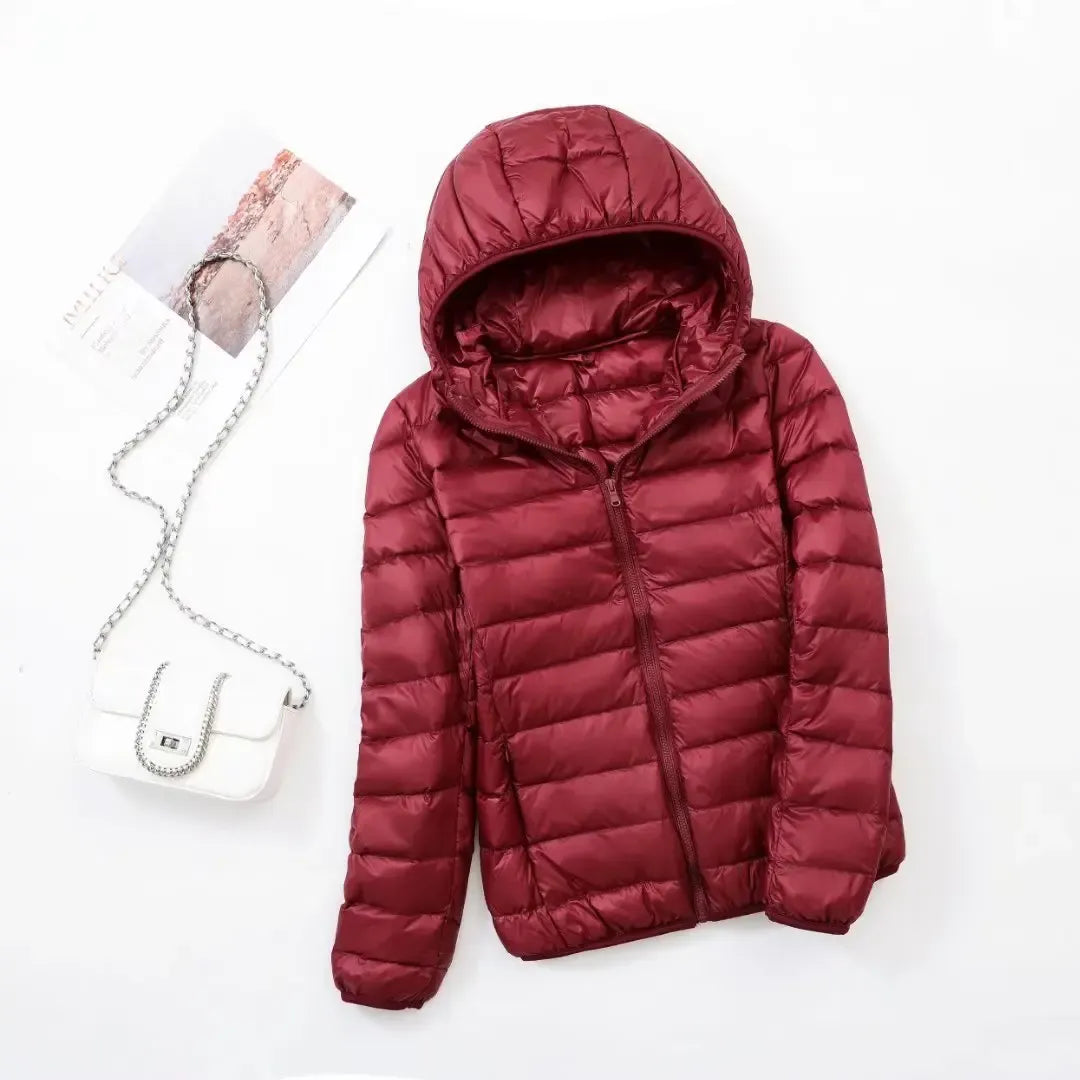 Chic women's sporty puffer jacket, warm and active outerwear for a stylish winter.
