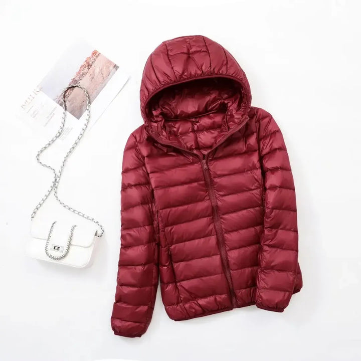 Chic women's sporty puffer jacket, warm and active outerwear for a stylish winter.