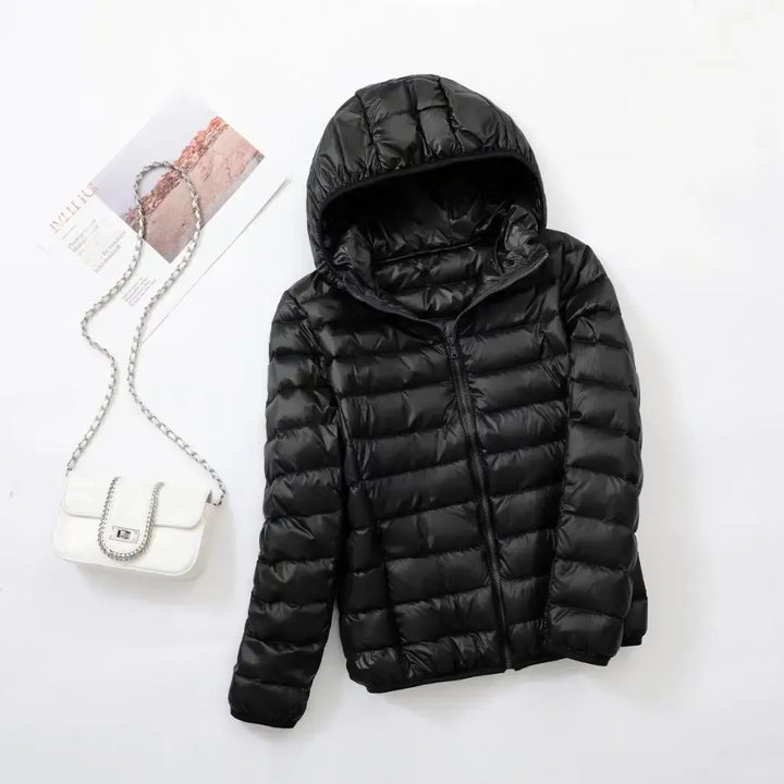 Sporty women's winter puffer jacket, warm, versatile, and modern for active ladies.