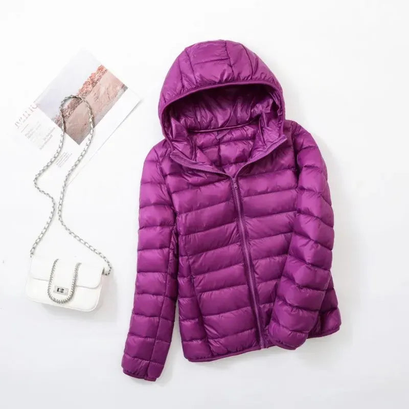 Women's fashionable puffer jacket, warm outerwear for modern, active, and cozy winter days.