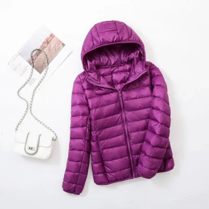 Women's fashionable puffer jacket, warm outerwear for modern, active, and cozy winter days.