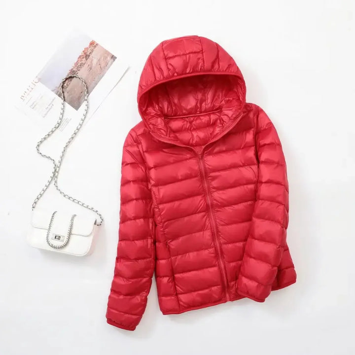 Modern sporty women's puffer jacket, providing ultimate warmth for winter and active fashion.