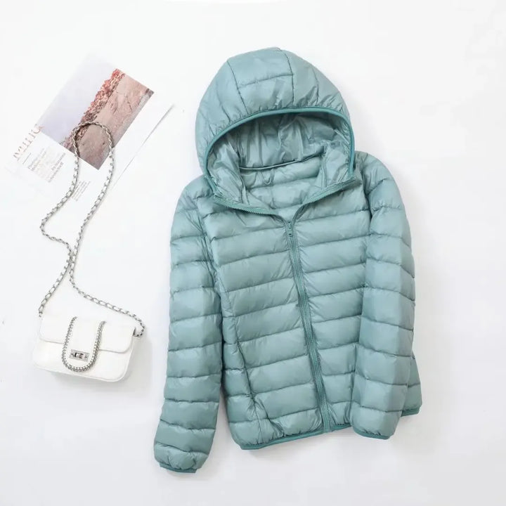 Chic & cozy women's puffer jacket, perfect for warm, active, and stylish winter outerwear.