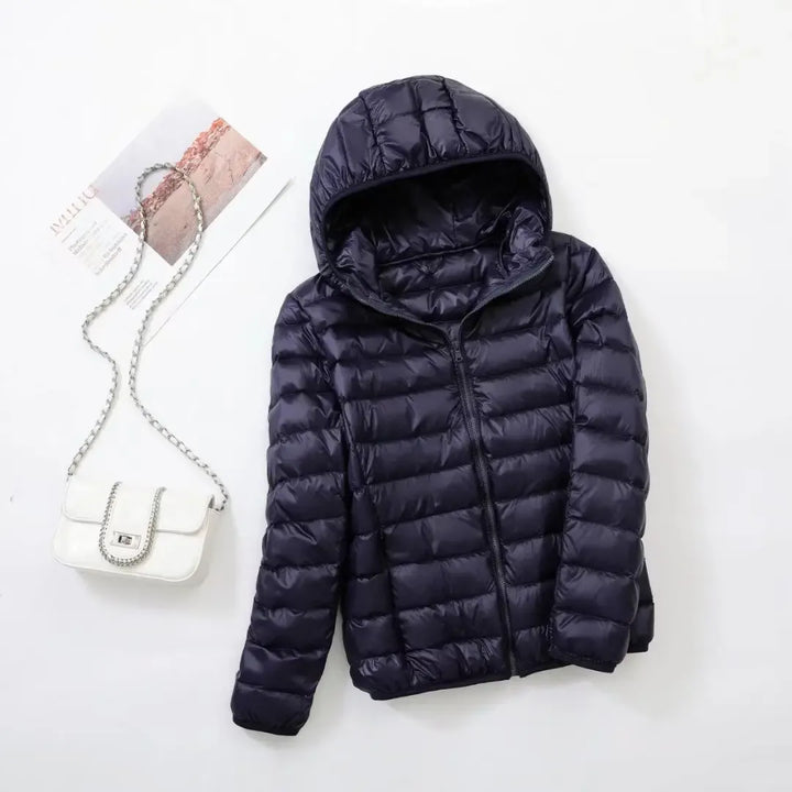 Women's warm sporty puffer jacket, a modern fashion statement for cozy winter adventures.