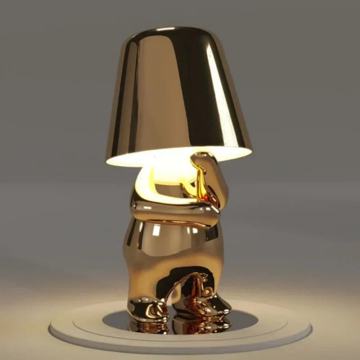 Cordless LED table lamp, artistic figurine design. Dimmable touch control for perfect ambiance.