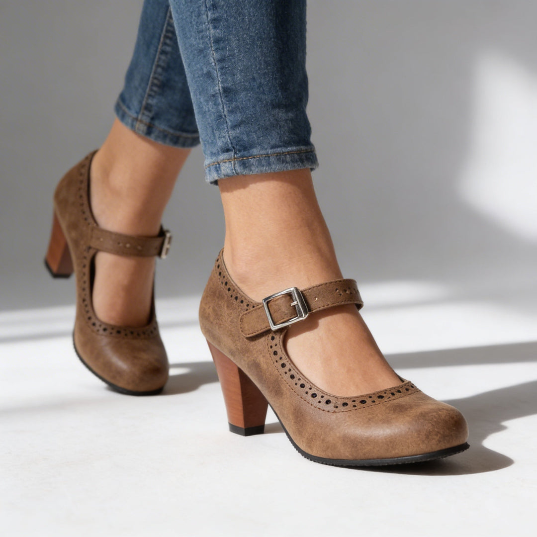 Women's black Mary Jane block heel brogue pump, classic design for office wear & everyday elegance.