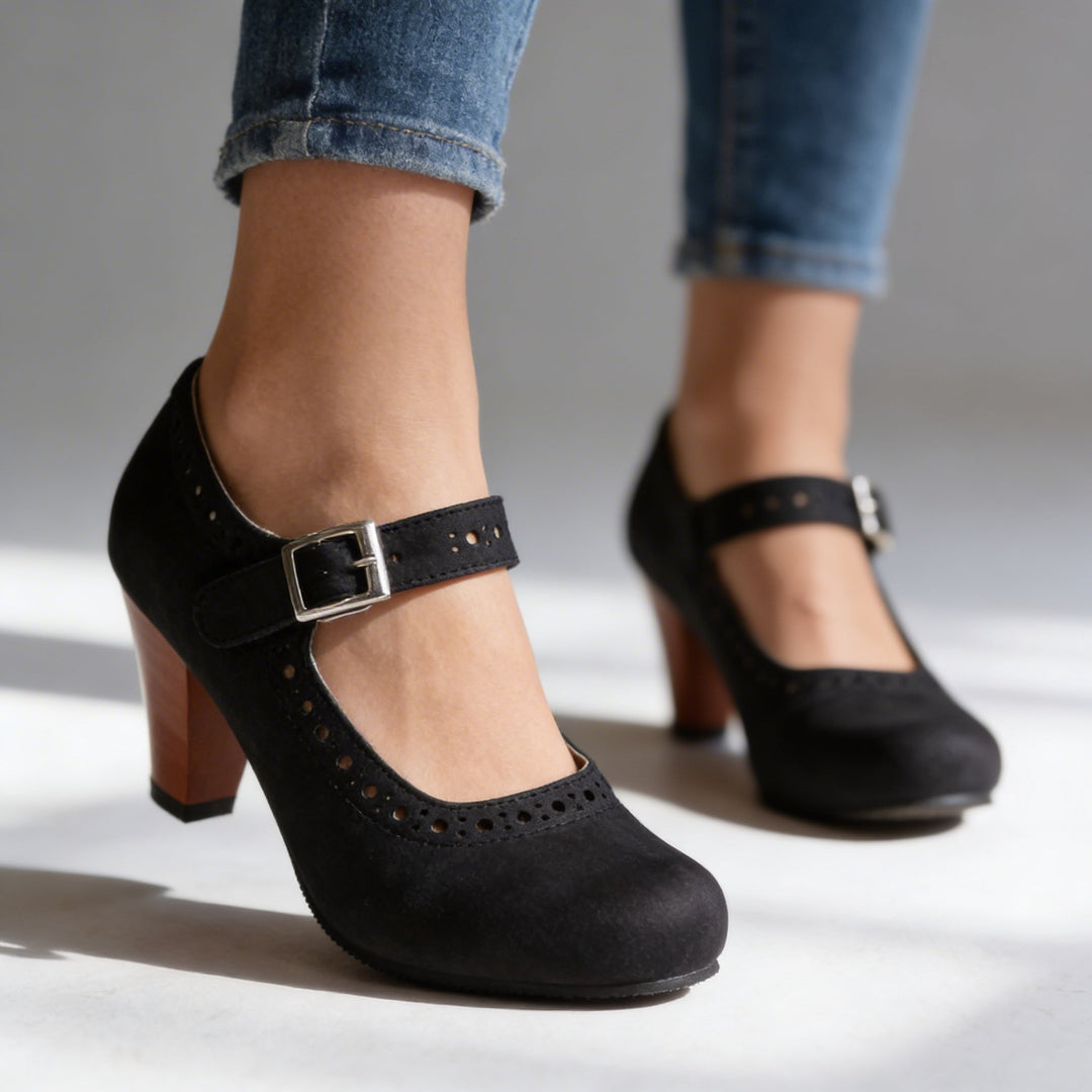 Vintage-inspired women's Mary Jane block heel pump with brogue detailing, perfect dress shoes.