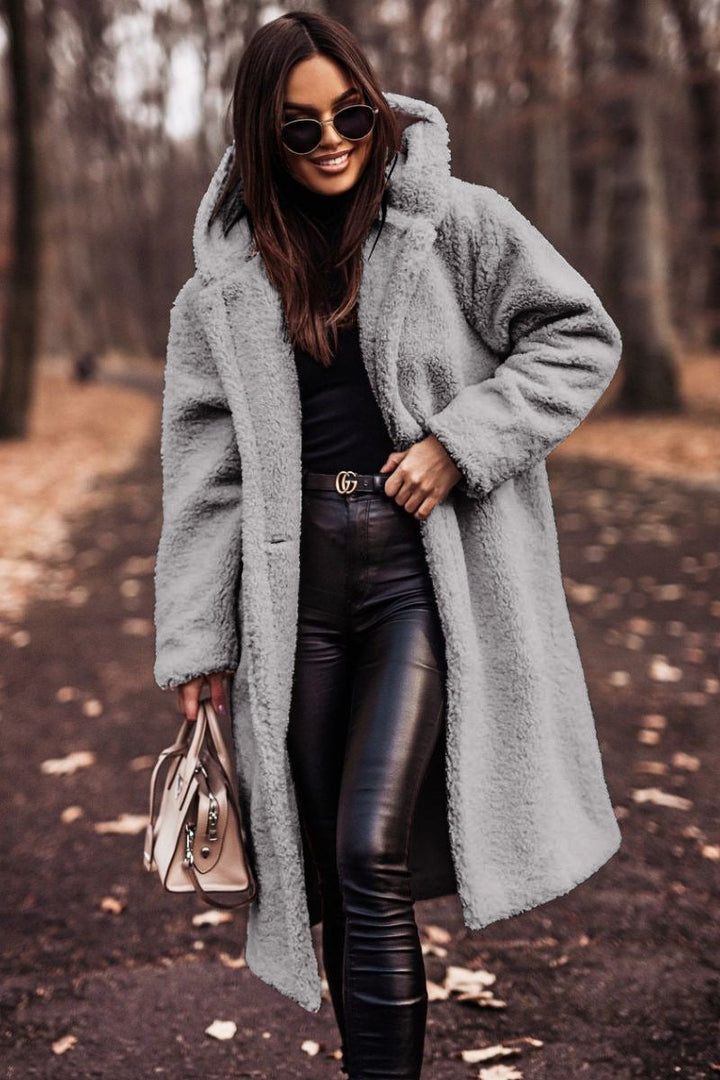 Cozy warm women's outerwear, elegant knee-length coat for winter layering.