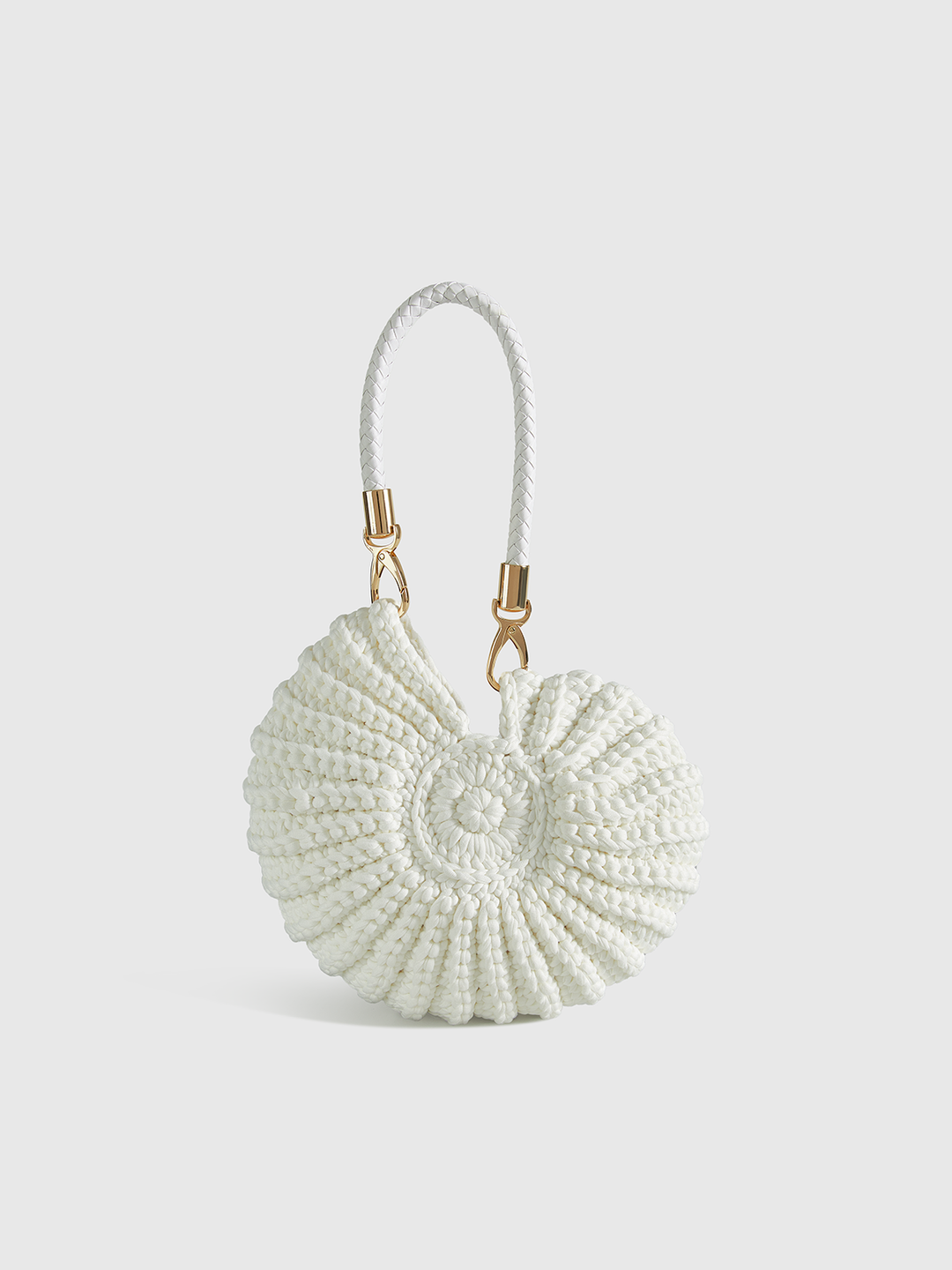 Women's unique conch-shaped crocheted handbag, a playful fashion accessory. Perfect shoulder or crossbody bag.