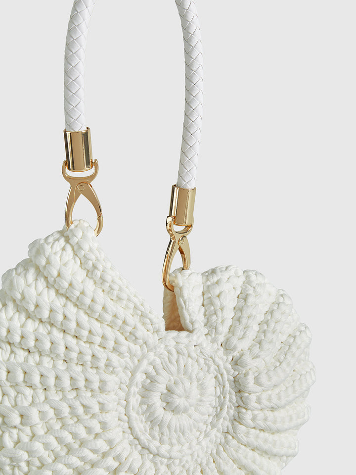 Fashionable women's conch-shaped crochet handbag. Versatile shoulder or crossbody bag for a unique style. [[lstfy-media:4]]