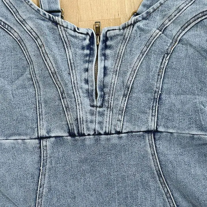 Stylish women's denim midi dress with adjustable straps, offering a comfortable, versatile look for everyday wear.