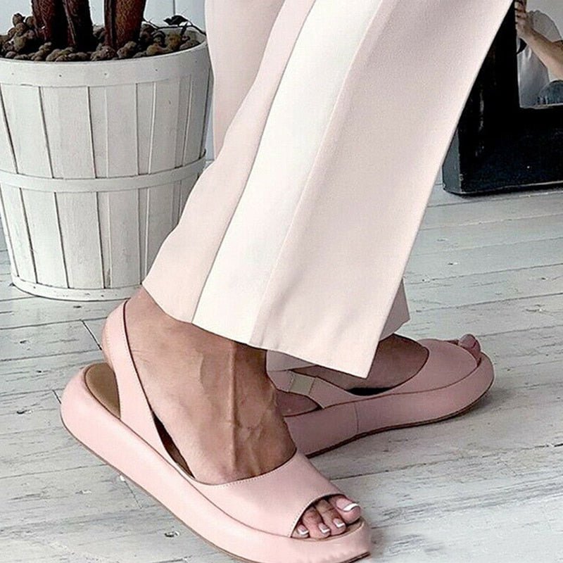 Elegant pink women's open toe sandals, cushion sole for all-day comfort, ideal for summer.