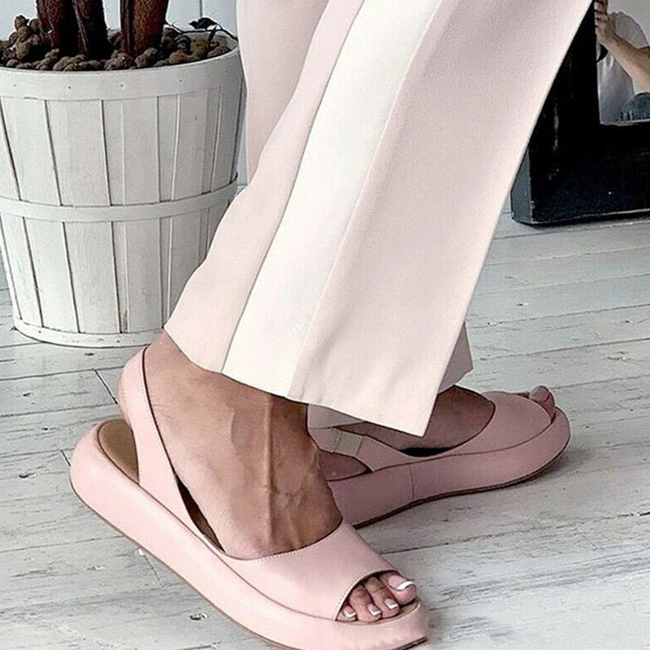 Elegant pink women's open toe sandals, cushion sole for all-day comfort, ideal for summer.