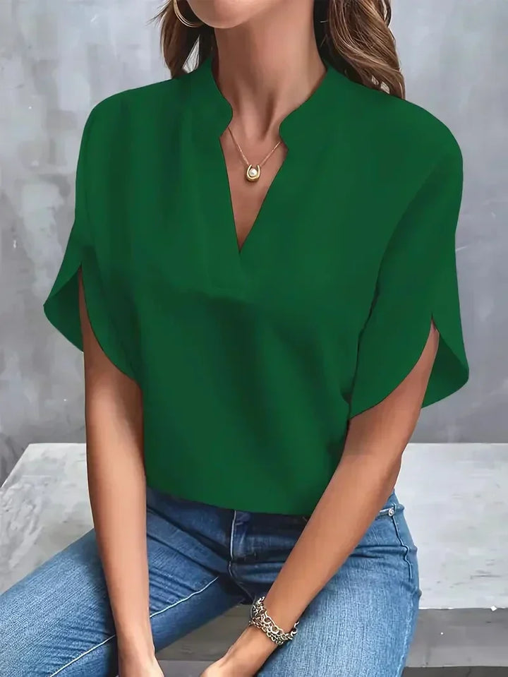 Women's chic V-neck top with split short sleeves, offering a sophisticated look for any occasion.