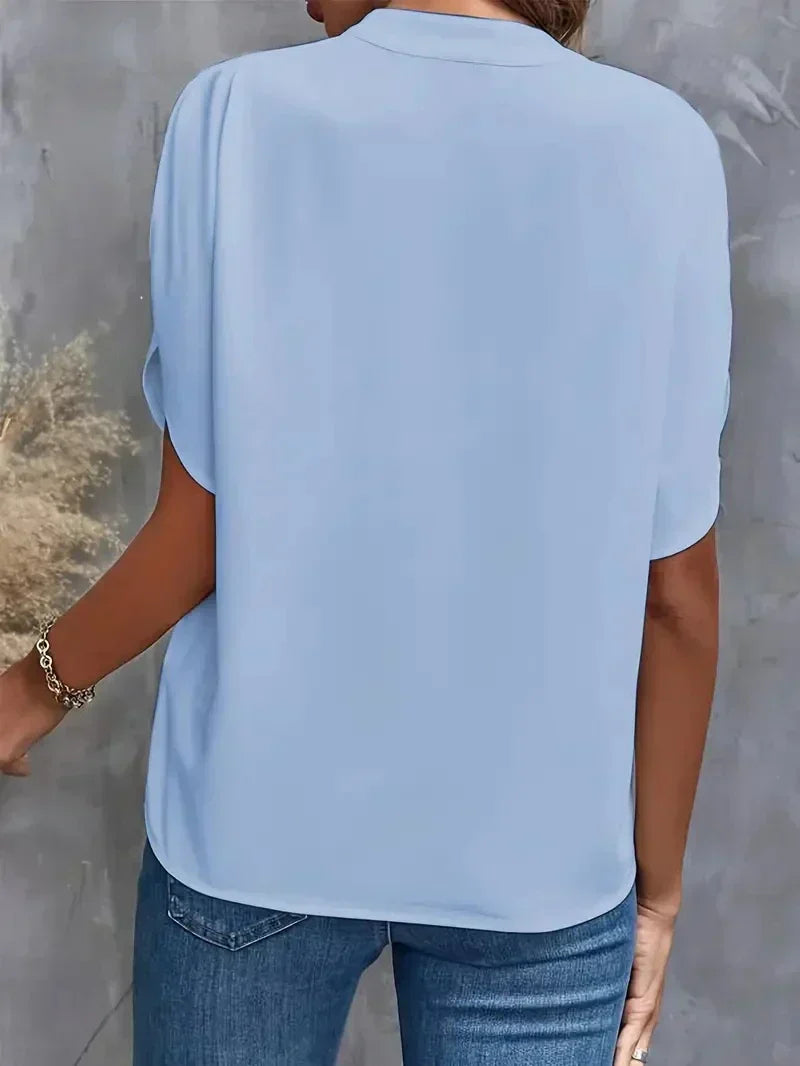 Casual elegant V-neck top for women, designed with chic split short sleeves for summer fashion.