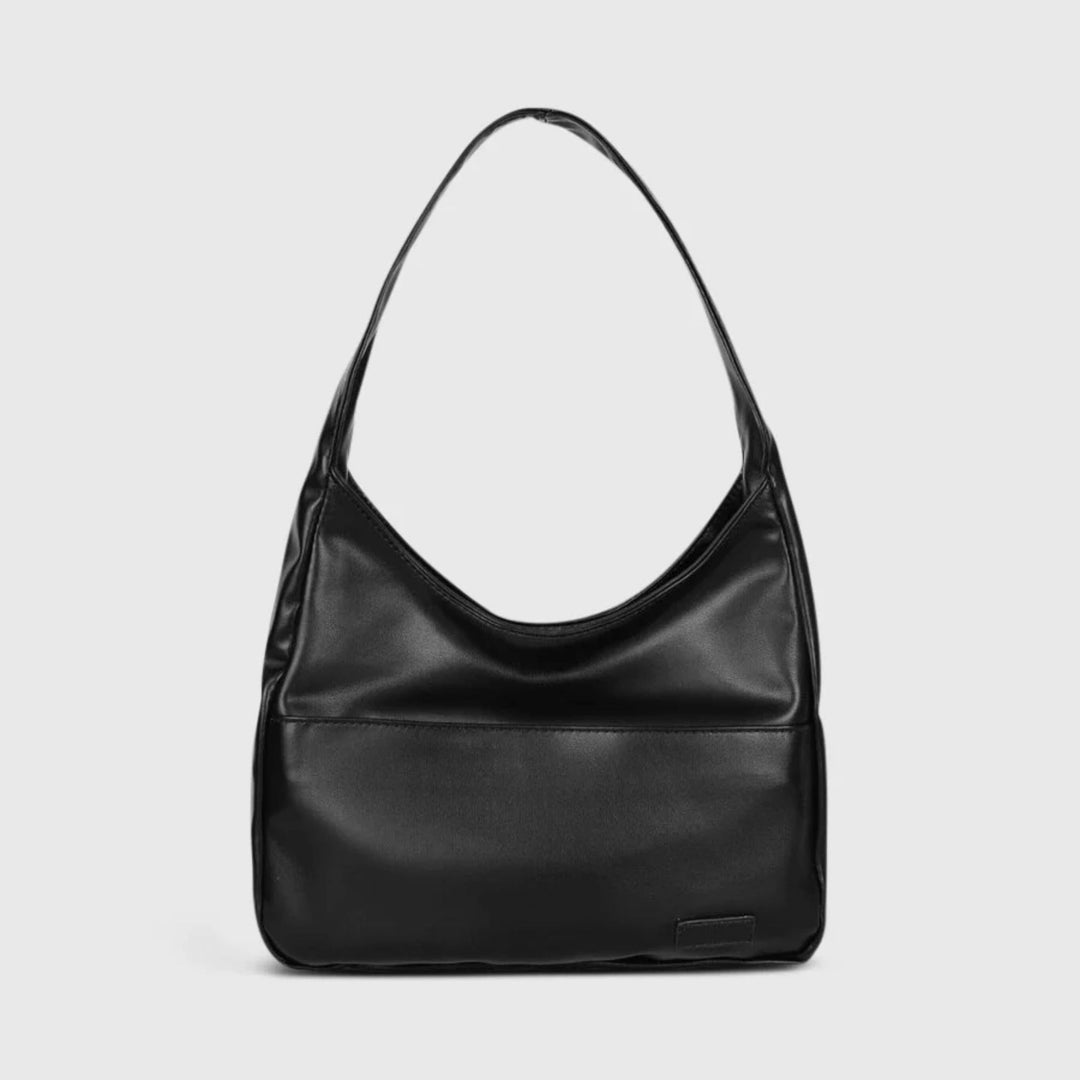 Chic women's vintage vegan leather crossbody bag. Perfect for work, travel, or an everyday stylish accessory.