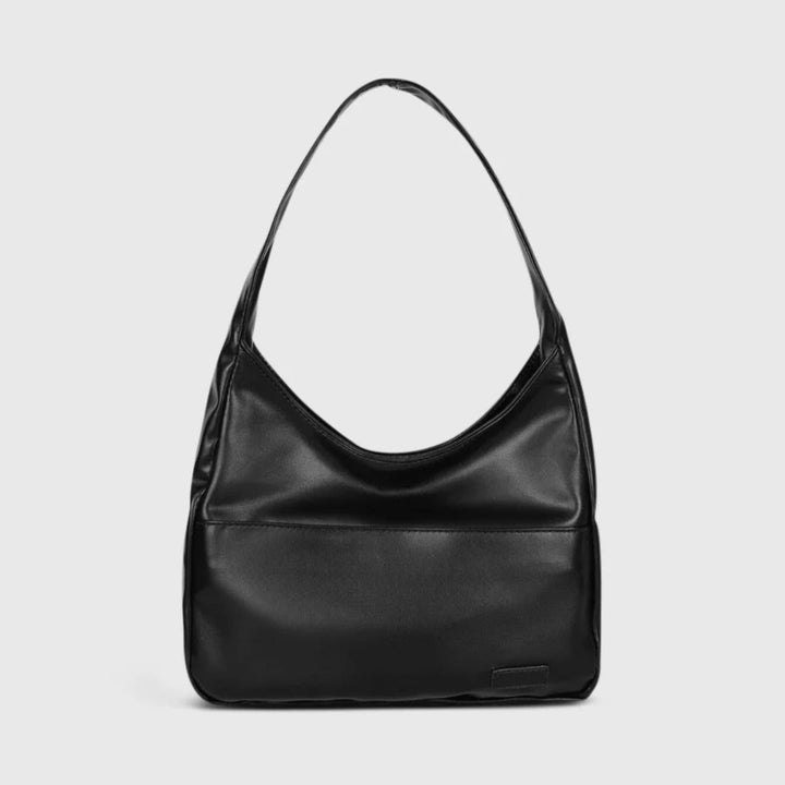 Chic women's vintage vegan leather crossbody bag. Perfect for work, travel, or an everyday stylish accessory.
