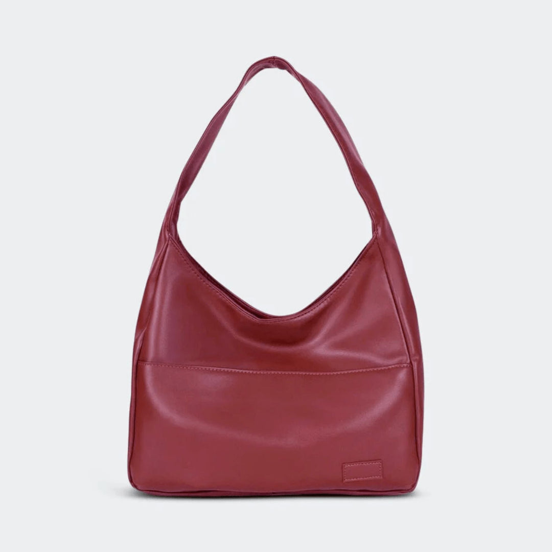Elegant round vintage vegan leather shoulder bag. A versatile women's handbag, ideal for everyday and work fashion.