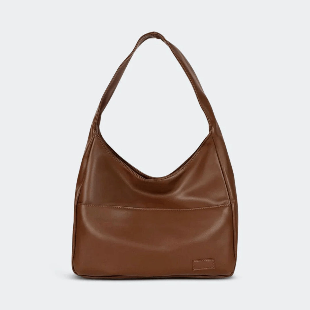 Vintage vegan leather women's shoulder handbag. Stylish everyday classic purse for fashion-conscious women.