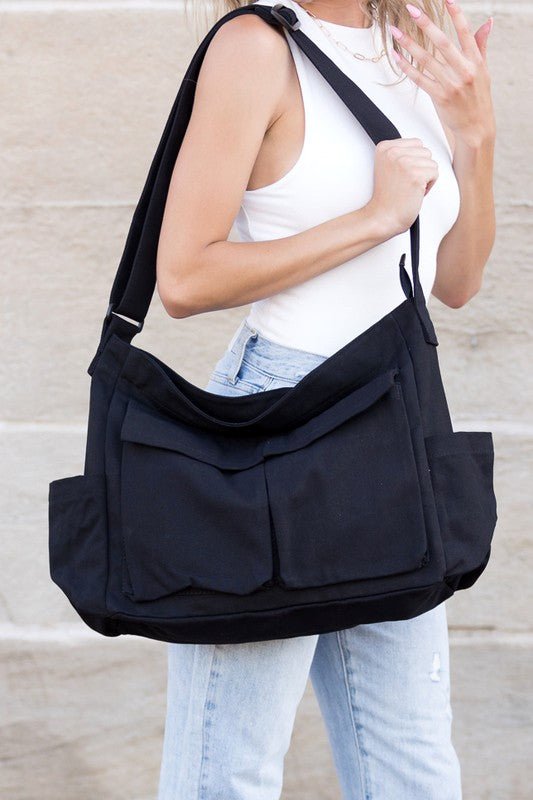 Stylish black canvas crossbody bag, a spacious tote for work, travel, or daily use.