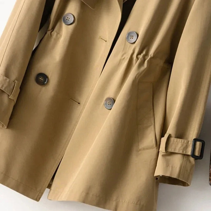 Stylish women's classic trench coat with double-breasted design, elegant outerwear for fashion-forward women.