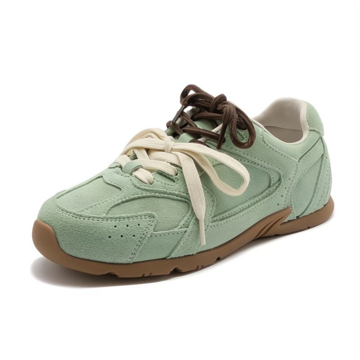 Modern women's dual-lace low-top sneakers, offering a blend of casual comfort and chic fashion.