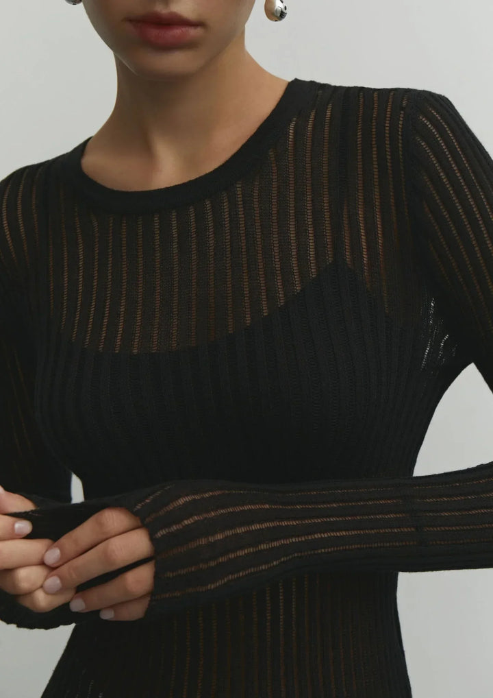Chic sheer long sleeve top for women, providing a comfortable and modern layering option.