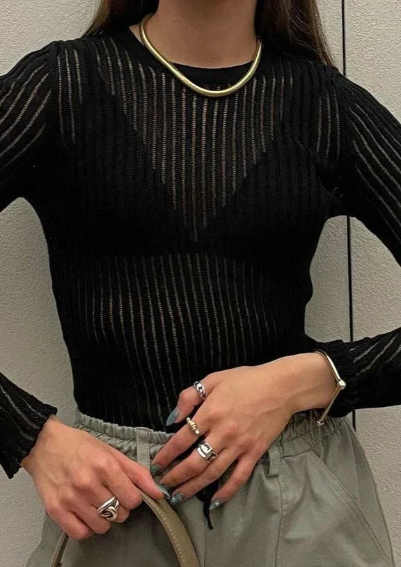 Lightweight women's sheer long sleeve top, an elegant and modern layering essential.