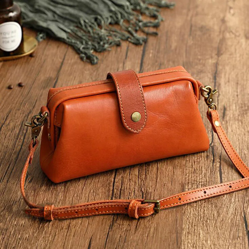 Women's vintage doctor bag style shoulder handbag in classic black PU leather, perfect for everyday fashion.