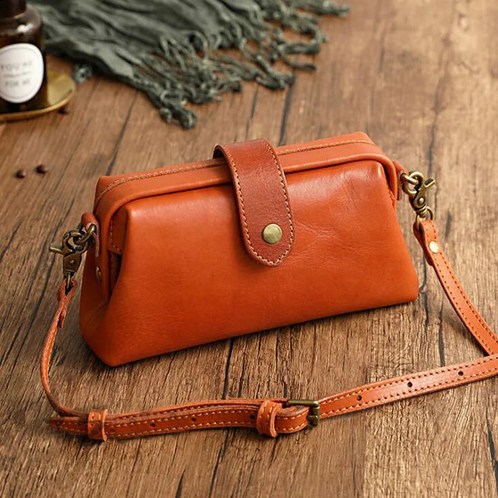 Women's vintage doctor bag style shoulder handbag in classic black PU leather, perfect for everyday fashion.