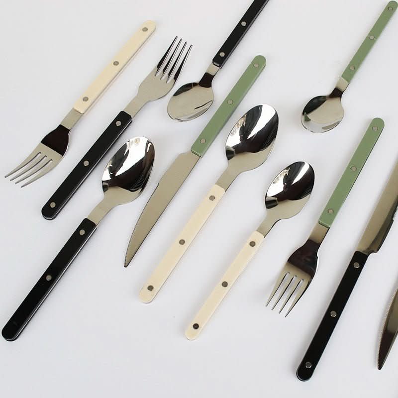 Elegant 24-piece engraved stainless steel dining cutlery set, perfect for stylish table settings.