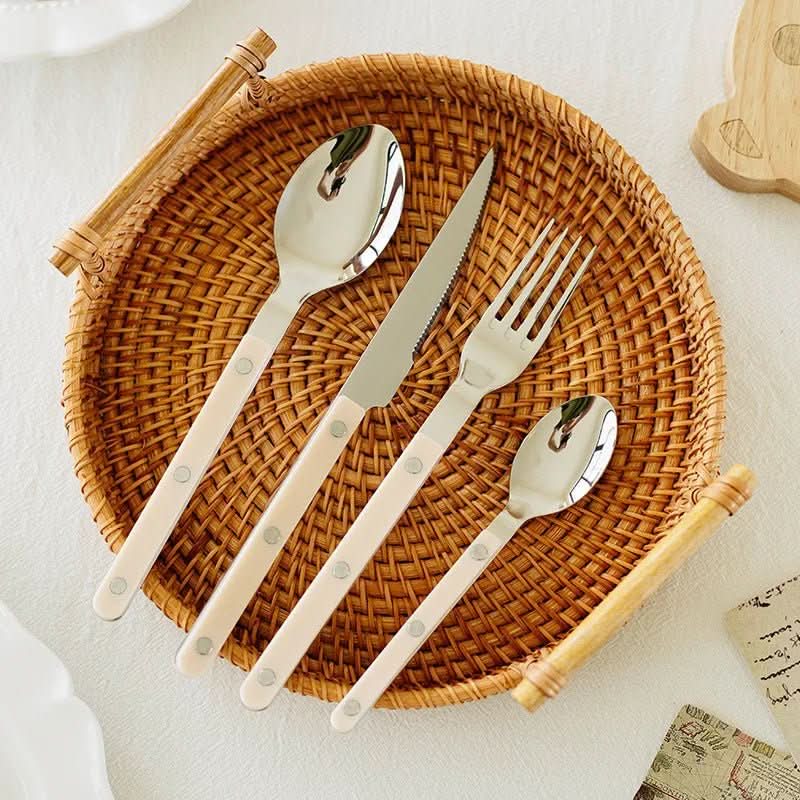Premium 24-piece stainless steel flatware set with intricate engraving, durable for everyday use.