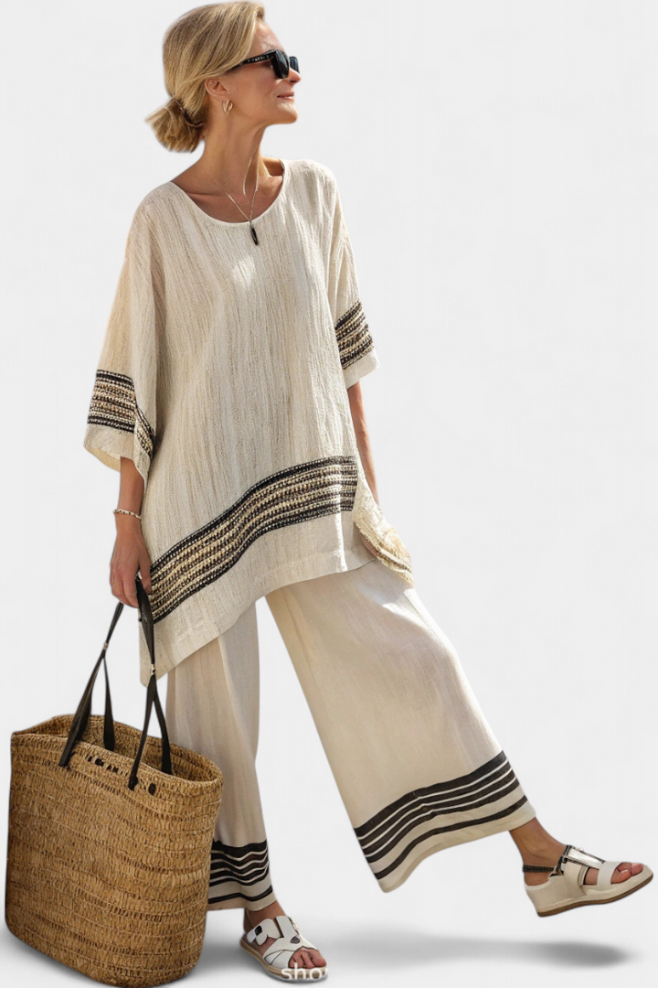 Women's elegant black-striped two-piece outfit set, relaxed fit for chic summer fashion & coastal style.