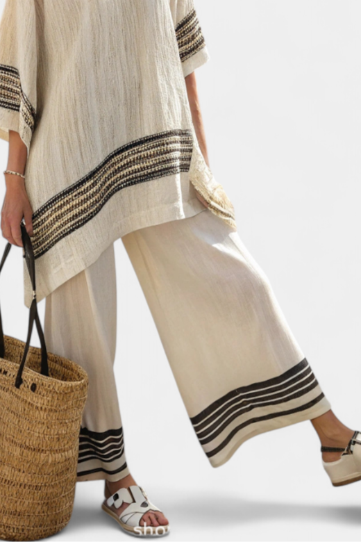 Elegant women's black-striped two-piece set; relaxed fit for comfortable, chic summer and coastal fashion.