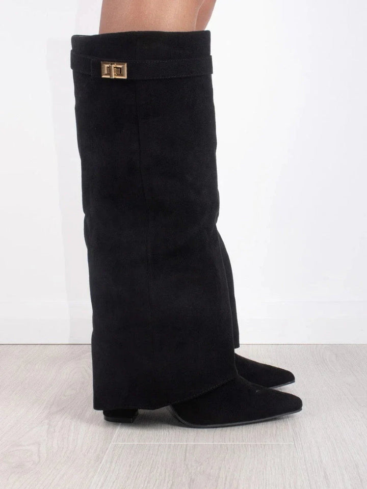 Chic women's over-the-knee boots. Pointed toe, low heel. Modern, elegant footwear for stylish confident wear.