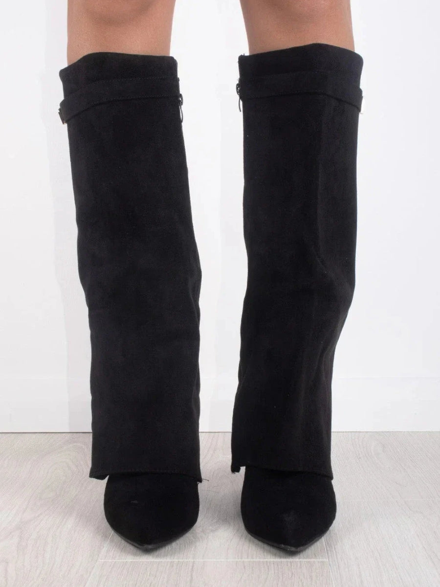 Sleek women's over-the-knee boots. Pointed toe, low heel. Fashion-forward elegant footwear for confident strides.