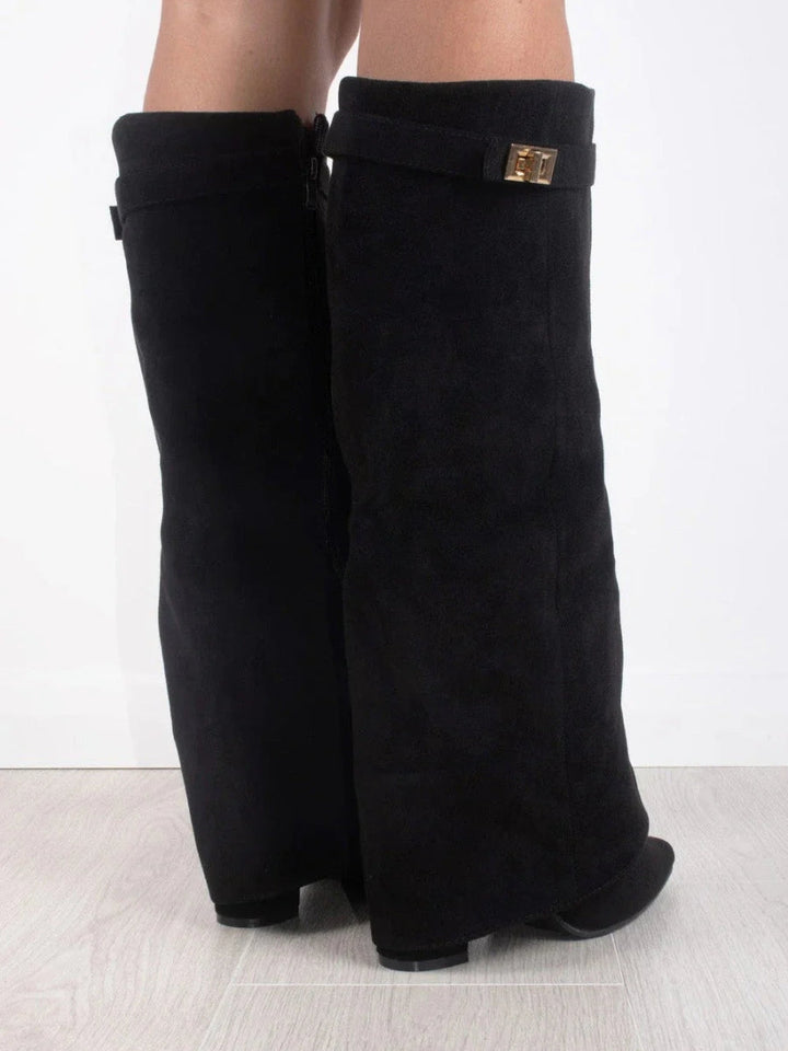 Fashionable women's over-the-knee boots. Tall, elegant with pointed toe & low heel for chic style.