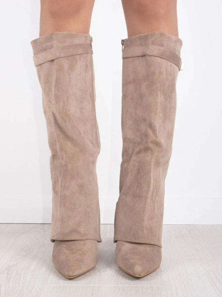 Elegant women's over-the-knee footwear. Pointed toe, low heel. Perfect dress boots for confident, stylish strides.