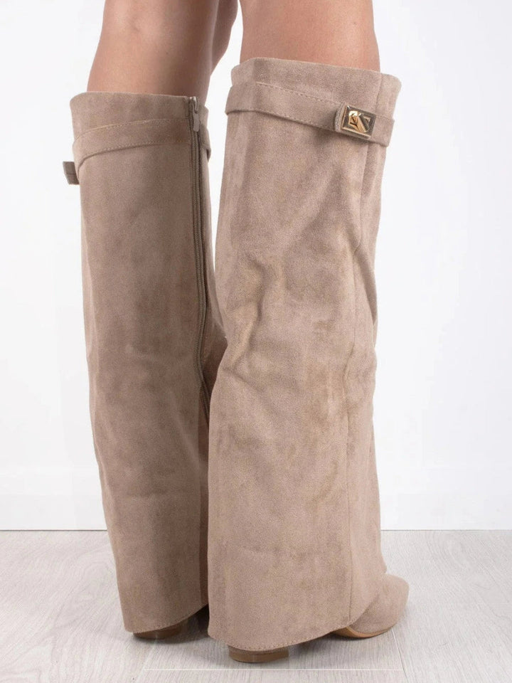 Women's stylish tall over-the-knee boots. Sleek pointed toe & low heel. Chic fashion footwear.