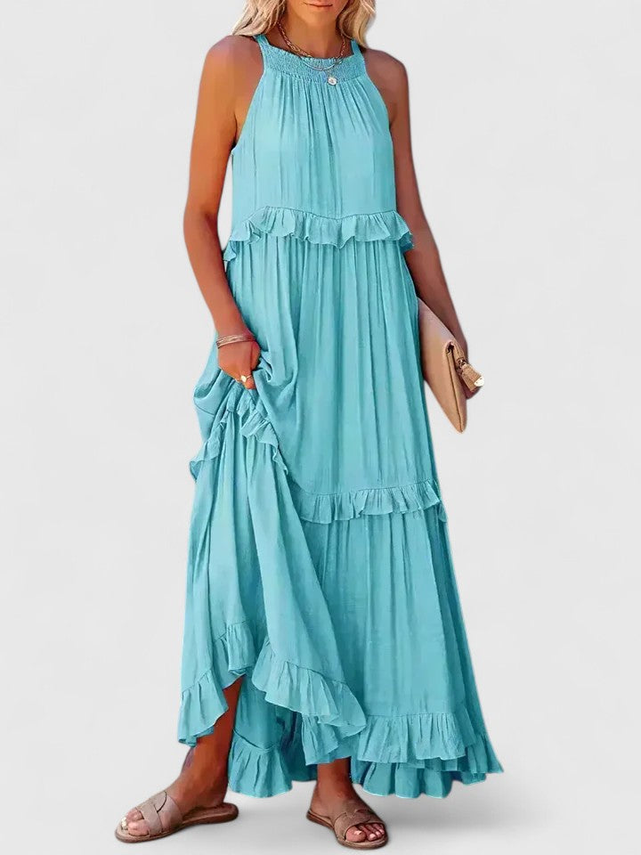 Boho chic white flowy maxi dress with ruffle detailing, a comfortable choice for summer fashion.