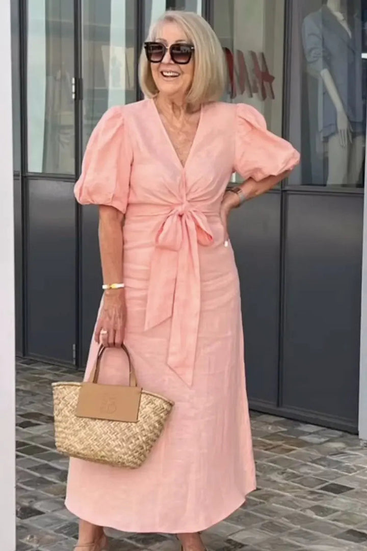 Chic V-neck women's dress with puff sleeves, a versatile midi length for parties or casual wear.