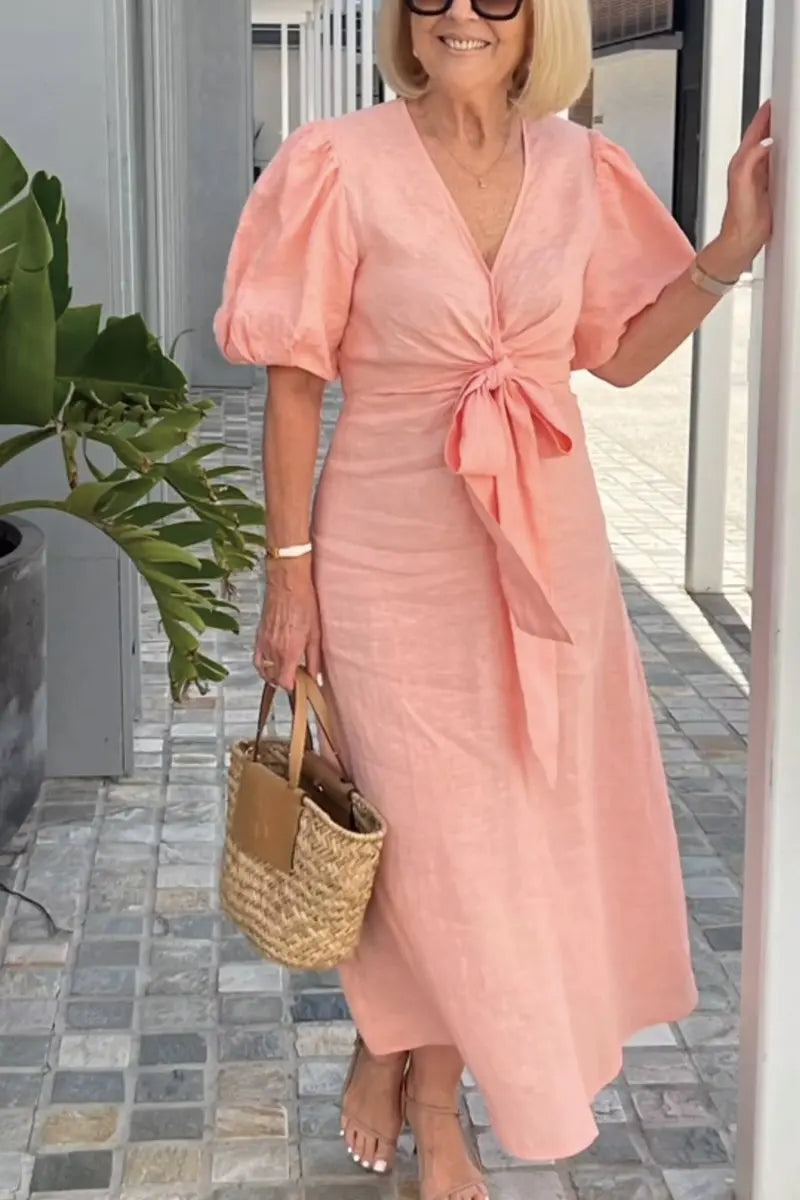 Stylish cocktail party dress for women, featuring a flattering V-neck and elegant midi silhouette.