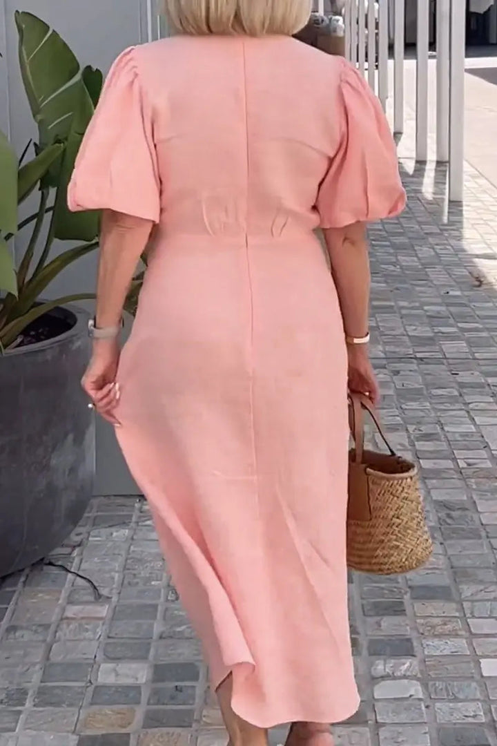 Formal women's V-neck midi dress, designed for sophisticated wedding guest attire or special events.