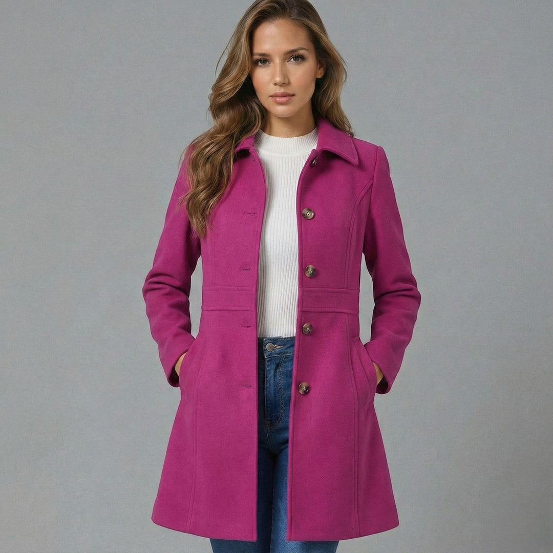Detail of elegant button closure on a classic A-line women's long coat for fall/winter fashion.