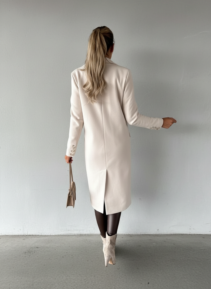 Sophisticated women's long double-breasted coat, a classic piece for elegant winter fashion and professional wear.